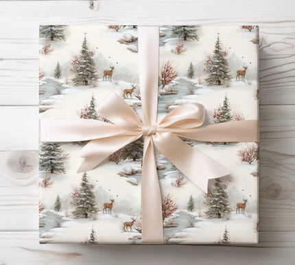 Peaceful snowy forest scene with deer and river, ideal for serene and nature-inspired holiday wrapping. 