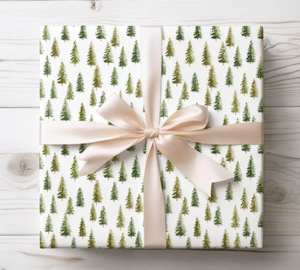 Bring the beauty of winter woodlands to your gifts with SylvaWhisper, a watercolor green pine tree Christmas wrapping paper. Featuring hand-painted evergreens on a snowy white backdrop, this premium 90 GSM gift wrap is available in matte or glossy finishes and multiple sizes. Perfect for holiday presents, festive gatherings, or rustic woodland-themed décor, this design adds a natural, timeless elegance under the tree. 
