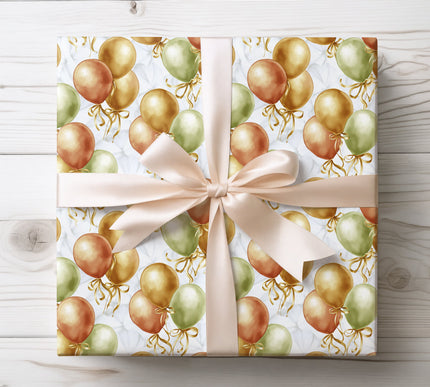 Soft watercolor golden balloons, ideal for sophisticated and joyful gift presentation. 