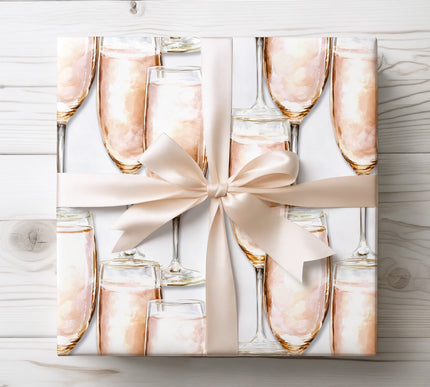 Soft champagne hues and delicate patterns create a luxurious and festive gift wrap. 