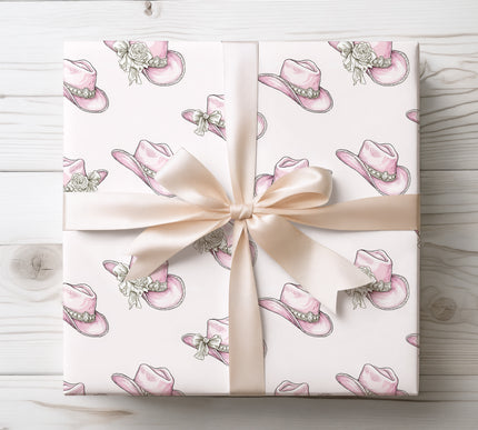 Cute pink cowboy hats adorned with flowers, ideal for western-themed parties and gifts. 