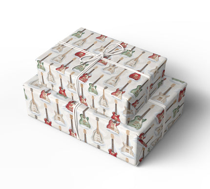 Rock around the Christmas tree with CoolChord Harmony, a wrapping paper featuring electric guitars in the snow. Perfect for music lovers, rock enthusiasts, and festive celebrations with a bold twist. 
