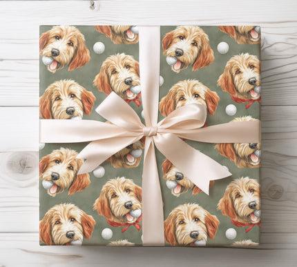 Friendly goldendoodle with a golf ball, ideal for golf and dog lovers wrapping gifts. 