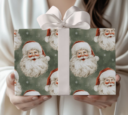 Holiday Green Gaze – Classic Santa heads with red hats on dark green snowy background wrapping paper
