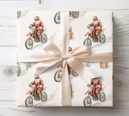 Dynamic Santa riding a motocross bike loaded with gifts, ideal for energetic and fun holiday wrapping. 