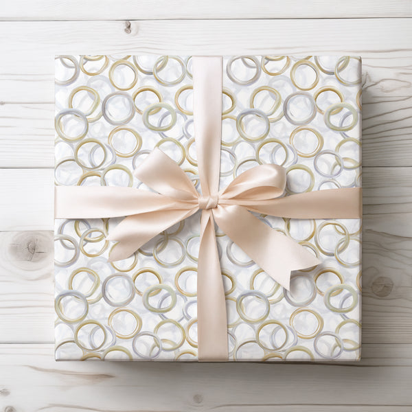 RingTide – Watercolor Gold and Silver Wedding Rings on White Wrapping Paper
