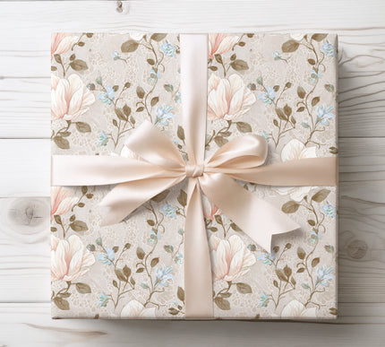 Soft white and peach flowers layered on vintage lace texture, creating a romantic and elegant wrapping paper. 