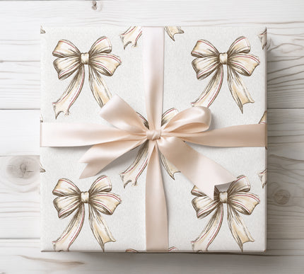 Charming beige bows accented with red details, perfect for rustic and warm holiday gift wrapping. 