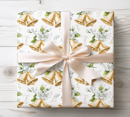 Graceful white flowers paired with shimmering golden bells in a seamless pattern, ideal for festive occasions. 