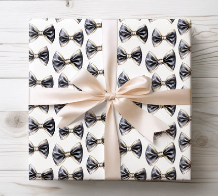 Sophisticated black and gold bowtie pattern on white, ideal for elegant and formal gift wrapping occasions. 