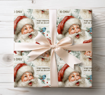 Playful Santa design with holly, bird, and customizable speech bubble text for personalized holiday wrapping. 