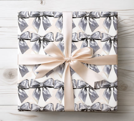 Shiny silver satin bow pattern adds a touch of elegance and charm, ideal for premium gift wrapping. 