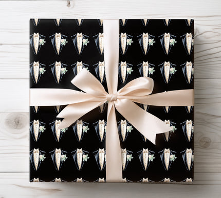 Luxurious wrapping paper featuring a golden formal tuxedo pattern, ideal for sophisticated celebrations and special occasions. 