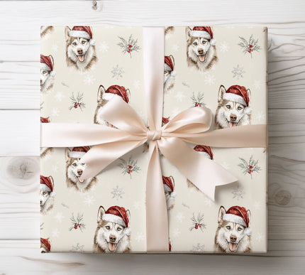 Festive wrapping paper featuring a happy husky in a Santa hat surrounded by snowflakes, perfect for winter celebrations. 