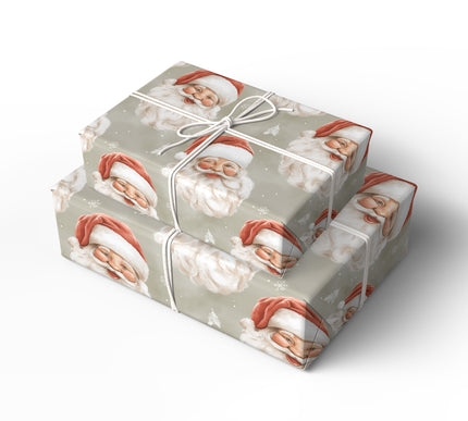 Merrywink Whimsy – Winking and smiling Santa faces on snowy beige background wrapping paper