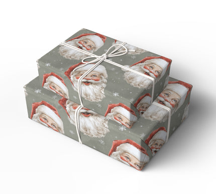 RetroClaus – Vintage Santa faces with snowflakes on a muted green background Wrapping Paper
