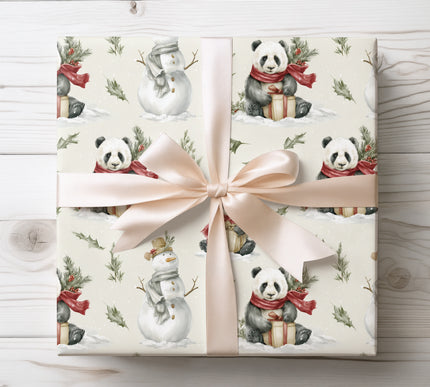 Adorable winter scene featuring playful pandas with presents and snowmen, great for festive gift wrapping.