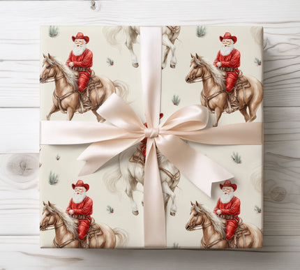 Unique festive wrapping paper featuring Santa riding a horse with a cowboy hat, blending western style and holiday spirit.
