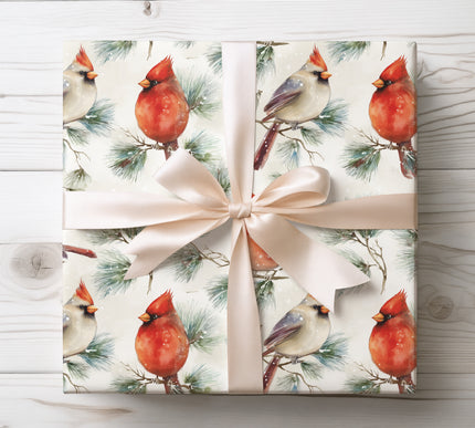 Festive wrapping paper with vibrant red cardinals and lush pine branches, perfect for seasonal gifting.
