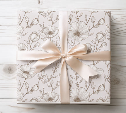 Modern wrapping paper with detailed brown poppy and leaf sketches on a soft blush background, offering a natural and chic look.