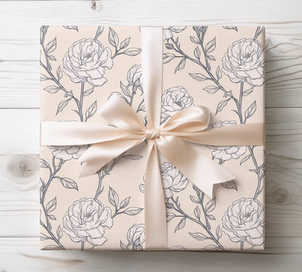 Timeless and elegant wrapping paper featuring delicate hand-drawn roses on a gentle beige background.