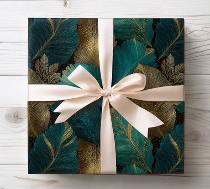 Wrap gifts in luxury with Gildfern wrapping paper showcasing gold and teal palm leaves. Ideal for elegant and tropical-inspired occasions.