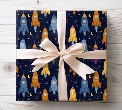 Ignite adventure with Cosmic Voyager wrapping paper featuring dynamic space rockets. Ideal for science lovers and imaginative gifting.