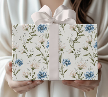 Petalwhisper Dusk – Elegant floral design with blue and cream blossoms on ivory wrapping paper