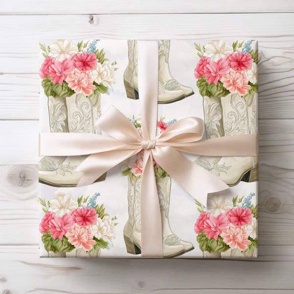 Roserune Westspur – White cowboy boots filled with pink and white flowers wrapping paper