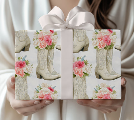 Roserune Westspur – White cowboy boots filled with pink and white flowers wrapping paper