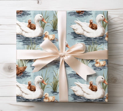 Share the joy of nature with Lakeside Quacksong wrapping paper showcasing a family of white ducks. Perfect for animal lovers and nature-themed gifts.