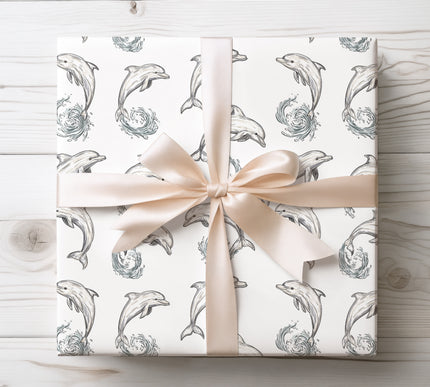 Bring ocean joy with WaveFlip wrapping paper showcasing playful dolphins amid rolling waves. Ideal for marine life fans and festive occasions.