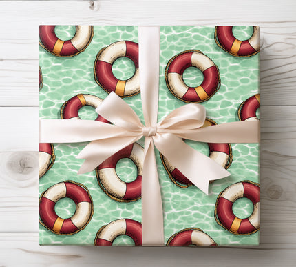 Add retro summer style to gifts with Driftloop wrapping paper showing vintage lifesaver rings over a pool water background. Great for pool parties, summer events, and nautical fans. High-quality paper with vibrant colors.
