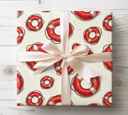 Bring coastal charm to your gifts with Floatward wrapping paper featuring lifebuoy rings. Ideal for nautical enthusiasts, summer birthdays, and beach-themed celebrations. Premium paper with crisp maritime graphics.