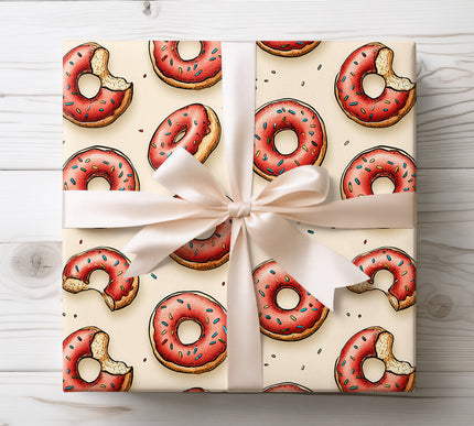 Add whimsy to gifts with Crumbbliss wrapping paper, featuring bitten donuts with sprinkles. Perfect for parties, birthdays, and dessert lovers. Durable paper with bright and cheerful artwork.