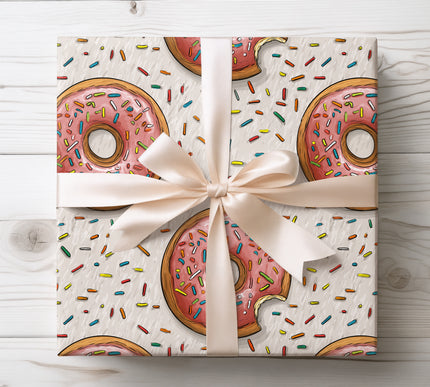 Sweeten your gift presentation with Glazewisp wrapping paper featuring pink donuts and colorful sprinkles. Ideal for birthdays, parties, and dessert lovers. Smooth, durable paper with bright, playful design.