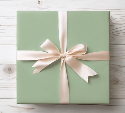 Embrace soft sophistication with Sage Whisper, a solid light sage green wrapping paper. Perfect for weddings, anniversaries, or understated holiday elegance. Its muted earthy tone makes it a versatile wrap for any celebration. 