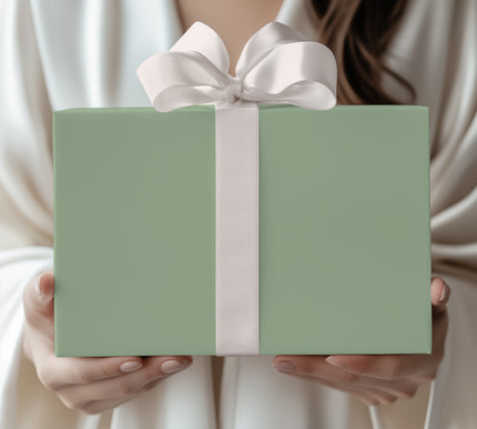 Embrace soft sophistication with Sage Whisper, a solid light sage green wrapping paper. Perfect for weddings, anniversaries, or understated holiday elegance. Its muted earthy tone makes it a versatile wrap for any celebration. 