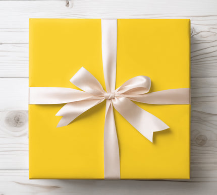 Shine bright with Golden Solara, a solid yellow wrapping paper that adds a burst of joy to birthdays, summer celebrations, and festive events. Premium-quality finish available in multiple sizes, making it versatile for any gift occasion. 