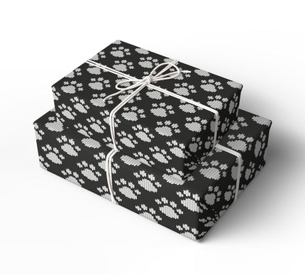 Celebrate your furry friends with Arctic Paws, a black and white knit paw print wrapping paper. This cozy, sweater-style design is perfect for dog lovers, pet-themed Christmas gifts, or winter birthdays. Available in matte or glossy finish, this festive wrap adds warmth and charm to every present. 