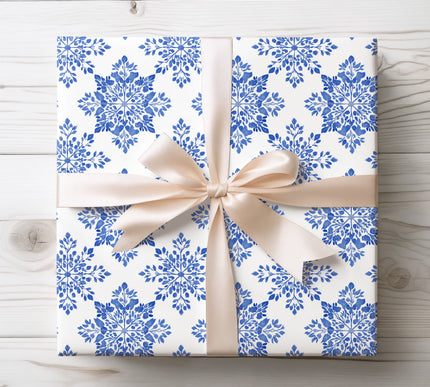 Bring winter elegance with Frostbloom, a blue snowflake wrapping paper perfect for Christmas, seasonal gifting, and snowy celebrations. 