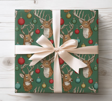 Elegant vintage-style Christmas wrapping paper featuring detailed hand-drawn deer and festive ornaments on dark green — perfect for rustic or classic holiday gifting. 