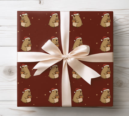 Whimsical capybara in Santa hats holding nuts — charming Christmas wrapping paper ideal for children’s gifts, animal lovers, and cozy festive packaging. 