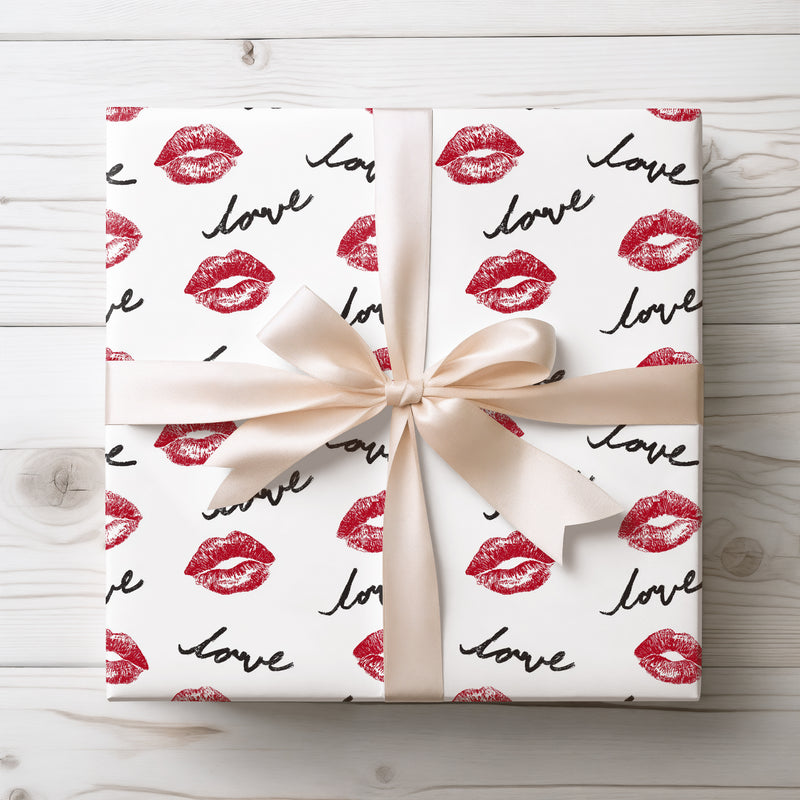 Kisscribe – Red lips and “love” cursive text pattern wrapping paper