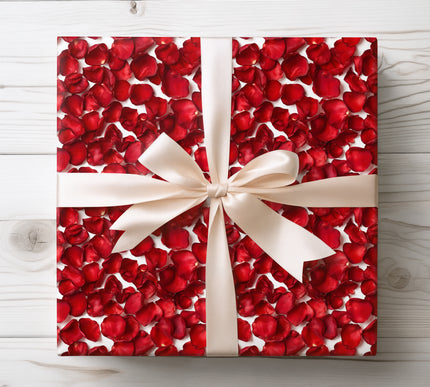 Realistic red rose petals on white wrapping paper 