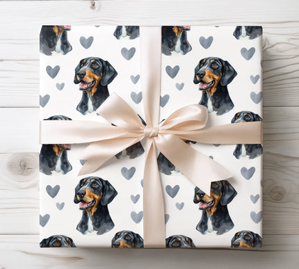 Elegant Black and Tan Coonhound wrapping paper showcasing a refined watercolor dog illustration with cool gray heart accents on a clean white background. Ideal for dog lovers, romantic gifts, Valentine’s Day, anniversaries, birthdays, or special occasions. This Black and Tan Coonhound watercolor wrapping paper delivers a timeless, bold, and heartfelt finish to every gift. 