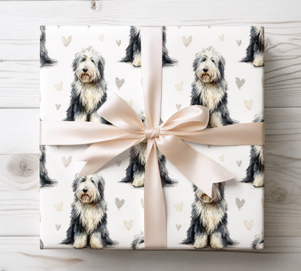 Soft watercolor Old English Sheepdog wrapping paper featuring realistic hand-painted dog portraits with gentle heart accents. Perfect for Old English Sheepdog lovers, dog parents, birthdays, Valentine’s Day, and heartfelt occasions. Premium seamless Old English Sheepdog wrapping paper that brings warmth, coziness, and timeless charm to every gift. 