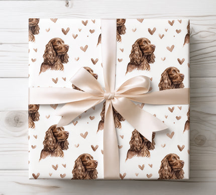 Elegant watercolor wrapping paper showcasing soulful Sussex Spaniel portraits paired with soft heart details. Seamless design with a cozy, romantic feel, ideal for dog lovers, Valentine’s Day gifts, special occasions, and premium heartfelt wrapping. 