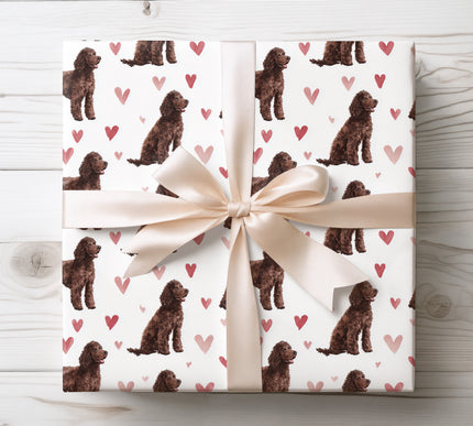 Beautiful Irish Water Spaniel wrapping paper showcasing a detailed watercolor illustration of the Irish Water Spaniel dog paired with warm heart motifs. Ideal for Irish Water Spaniel owners, dog lovers, Valentine’s Day gifts, birthdays, and special occasions. Premium seamless wrapping paper that adds a charming, heartfelt touch to any gift. 