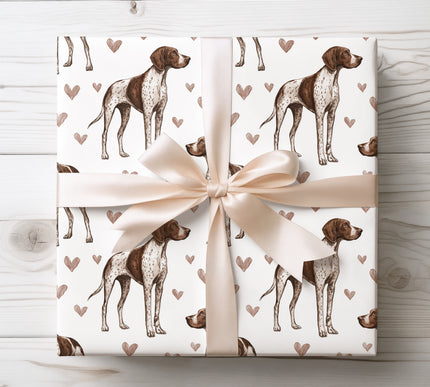Premium German Shorthaired Pointer wrapping paper featuring realistic watercolor German Shorthaired Pointer illustrations with soft warm heart accents on a clean white background. Perfect gift wrap for German Shorthaired Pointer owners, dog lovers, Valentine’s Day, birthdays, and elegant pet-themed gifts. High-quality wrapping paper with a refined, timeless, and affectionate design. 